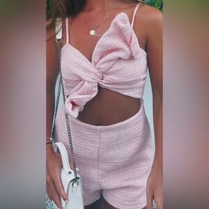 Light pink tweed romper with bow and cutout!